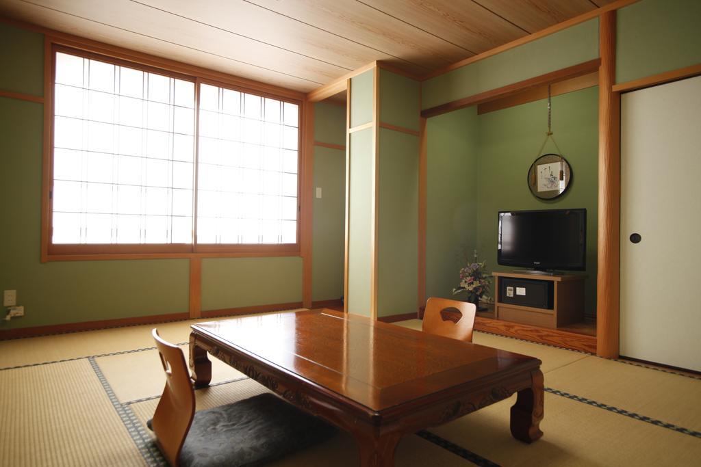 Отель Sazu Onsen Yusho Ками Номер фото